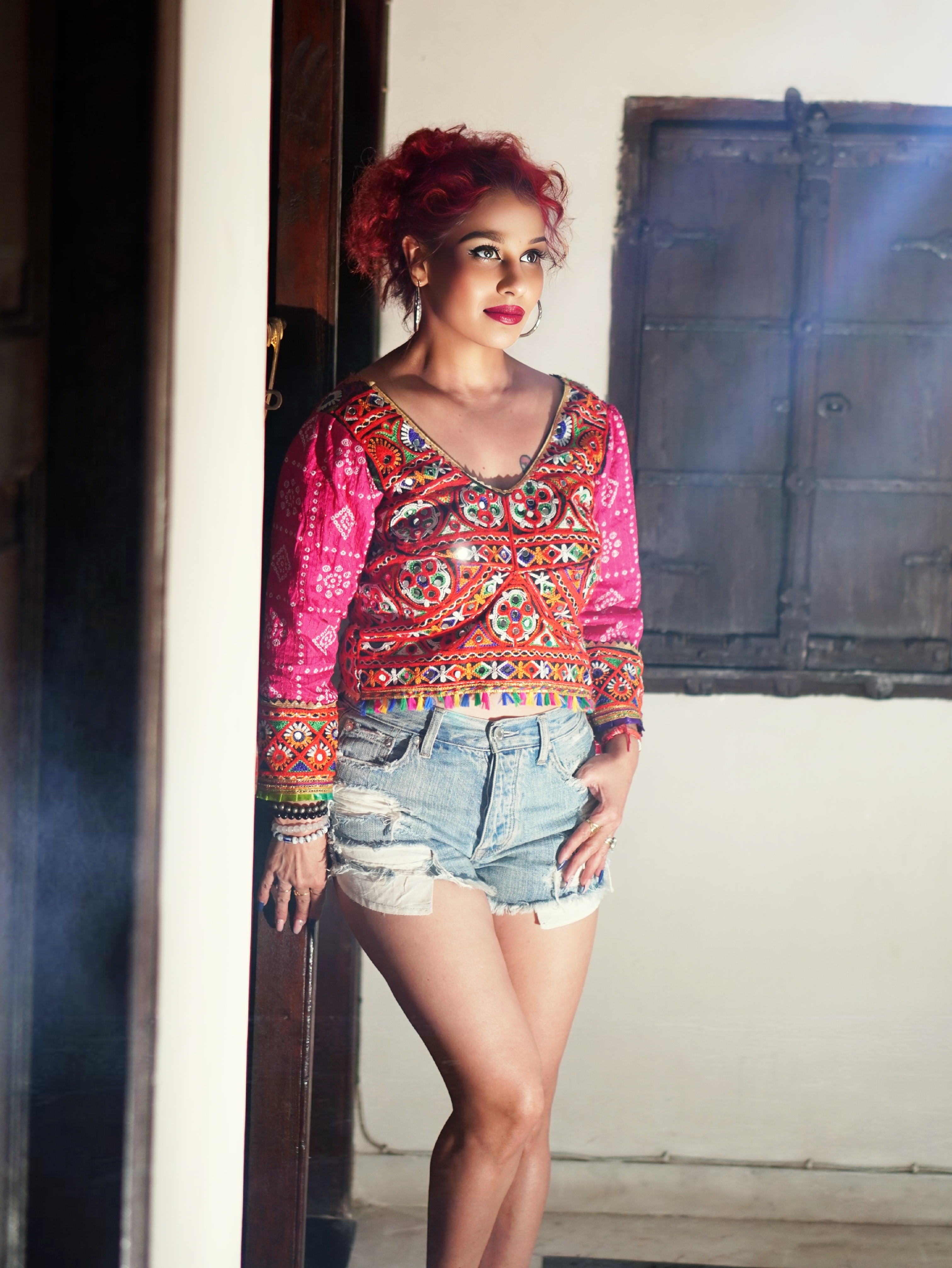 Kanak Raj - Kanak Raj in Vibrant Ethnic Top and Denim Shorts