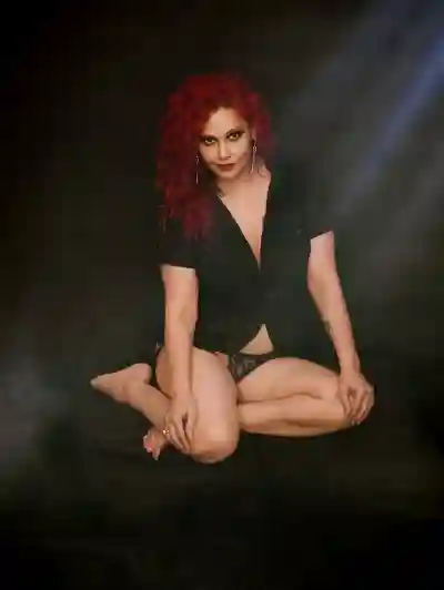 Kanak Raj, black shirt, sultry pose