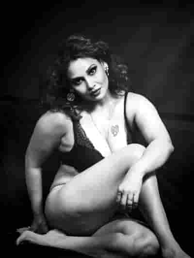 Black Lace Elegance in Confident Pose